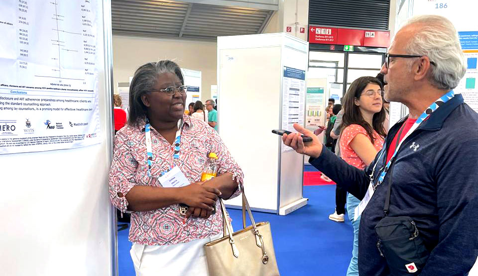 Dorina Onoya presenting at the poster exhibition at AIDS 2024 Dorina Onoya presenting at the poster exhibition at AIDS 2024